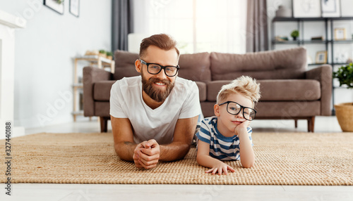 Father's day. Happy funny family son and dad with glasses