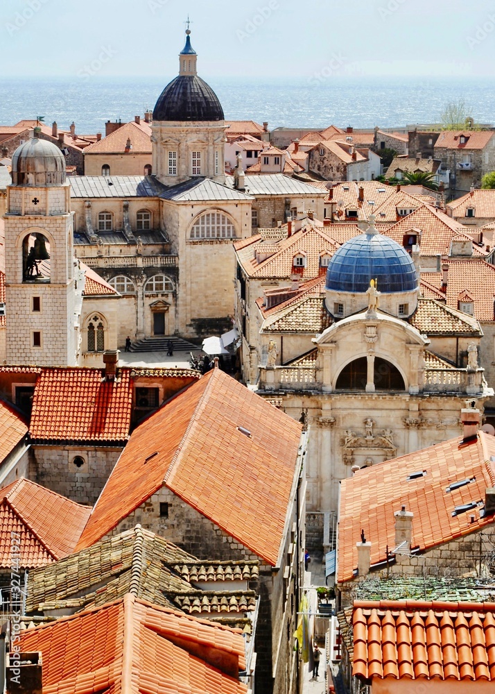 The red tiled and blue domed roofs of the old town are seen from the city wall in Dubrovnik, Croatia.