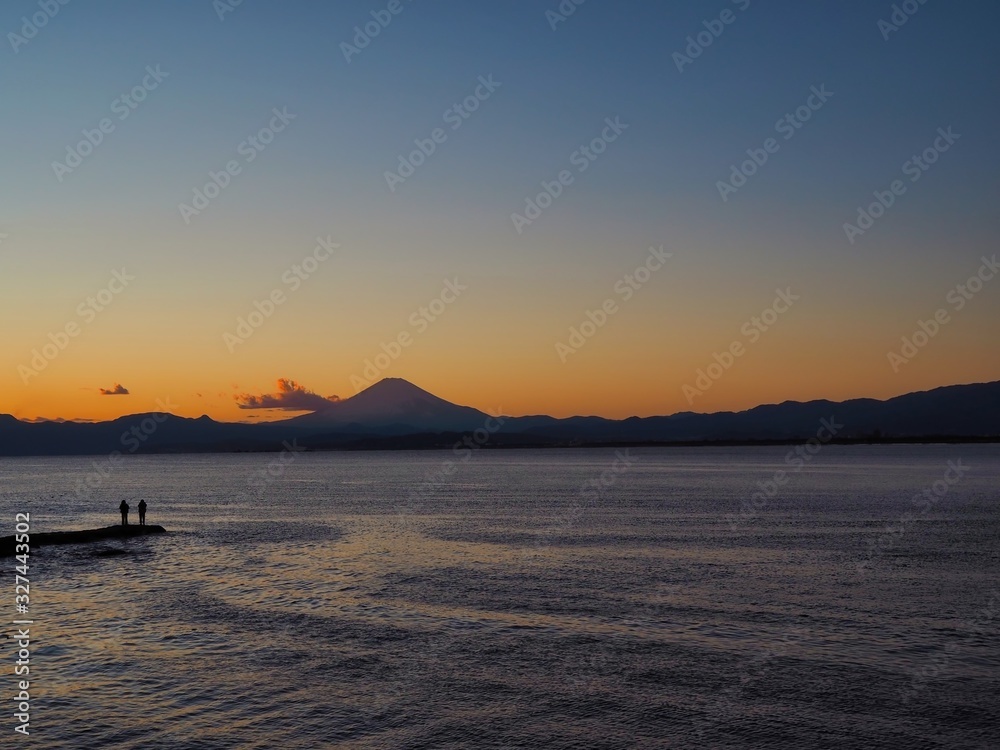 Beautiful sunset scenery with silhouette of Mt Fuji at Enoshima Island in Japan.