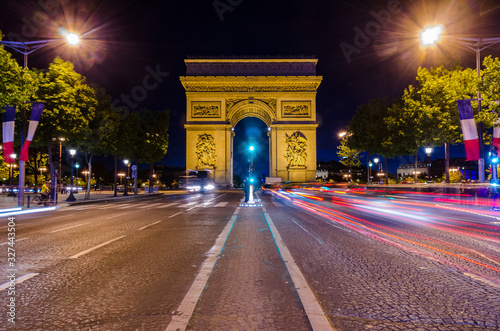 Magnificent view of Arc de Triomphe at night in Paris France © ujjwal