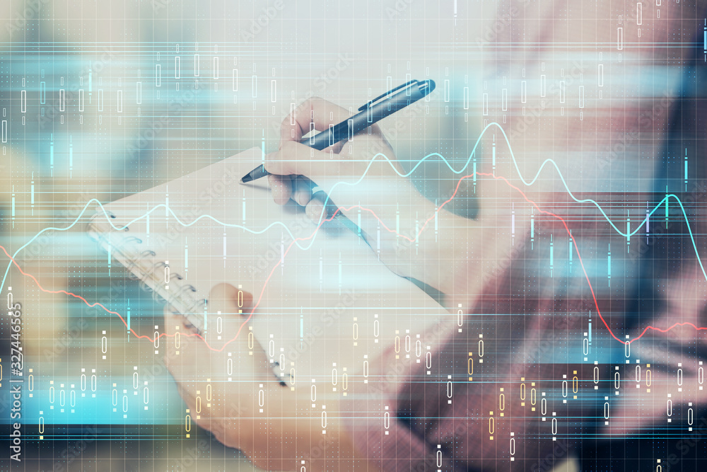 Multi exposure of hands making notes with forex chart huds. Stock market concept. Multi exposure of hands making notes with forex chart huds. Stock market concept.