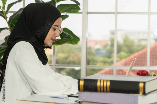 asian muslim business woman in jihab working in office photo