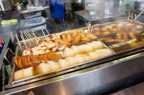 Japanese Oden street food background. Various types of Oden boiling in hot soup.