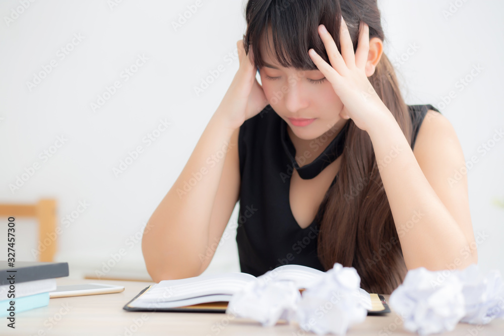 Beautiful asian woman tired and stressed with writing overworked at desk, girl with worried not idea with notebook and crumpled paper at office, freelance and business concept. Beautiful asian woman tired and stressed with writing overworked at desk, girl with worried not idea with notebook and crumpled paper at office, freelance and business concept.