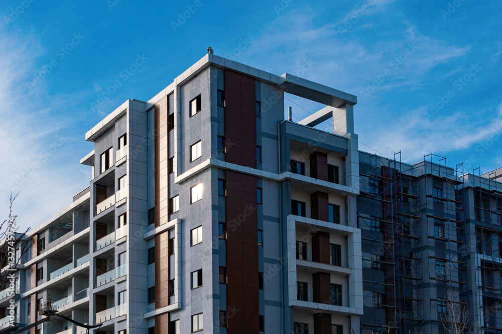 Fototapeta premium Modern apartments building at finishing stage. Modern architecture house