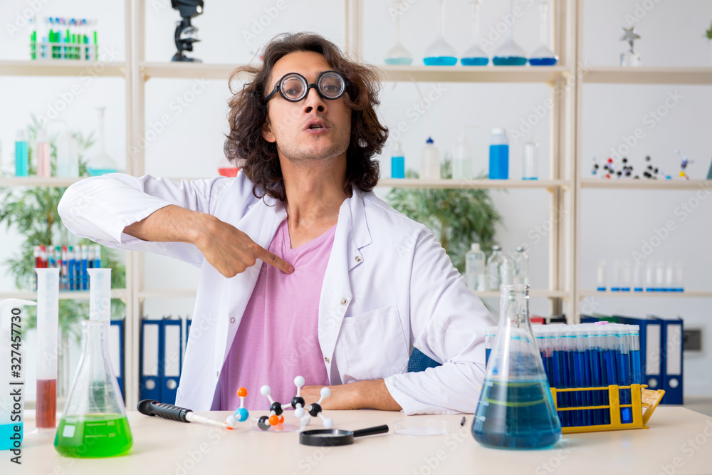 Funny male chemist working in the lab Funny male chemist working in the lab