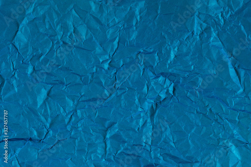  Blue background. Texture of crumpled blue paper.
