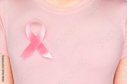 Wallpaper Mural World Breast Cancer Day Concept,health care - woman wore white t-shirt,Pink ribbon for breast cancer awareness, symbolic bow color raising awareness on people living with women's breast tumor illness Torontodigital.ca