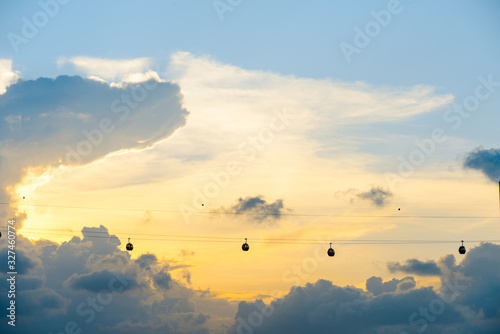 silhouette of singapore cable car transportation to sentosa island on the evening