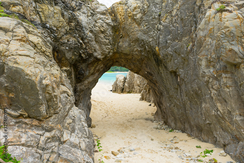 natural stone arch on Tokashiki island, Okinawa, Japan.