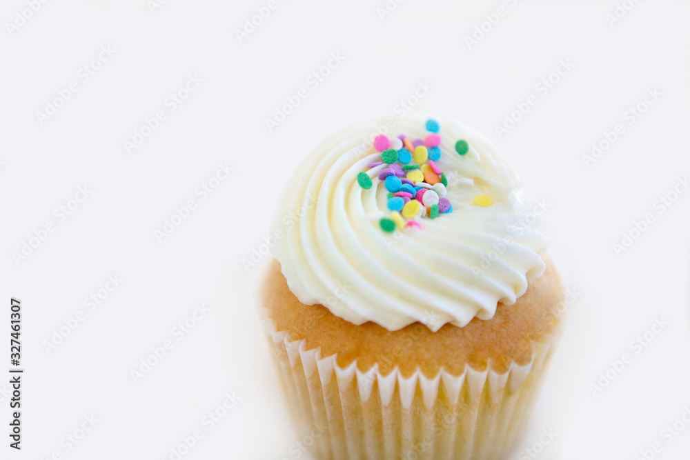 closeup birthday cupcake on white background