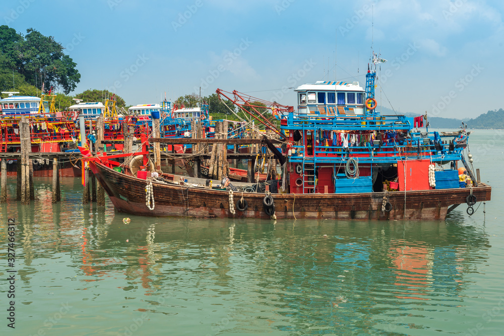 Many Fishing trawler are moored in the harbor of the small town Pekan Pangkor on the island of Pangkor on the west coast of Malaysia