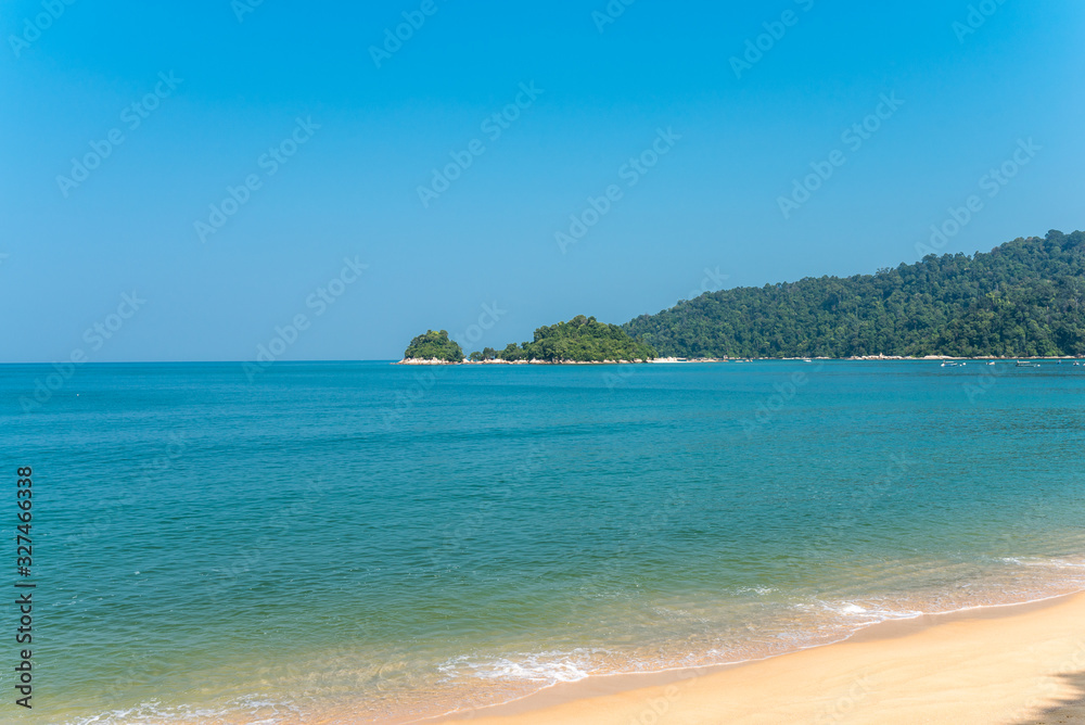 The island of Pangkor with the beach of the tourist village Teluk Nipah and the small isle of Giam in the Malaysian state of Perak at the west coast of the peninsular