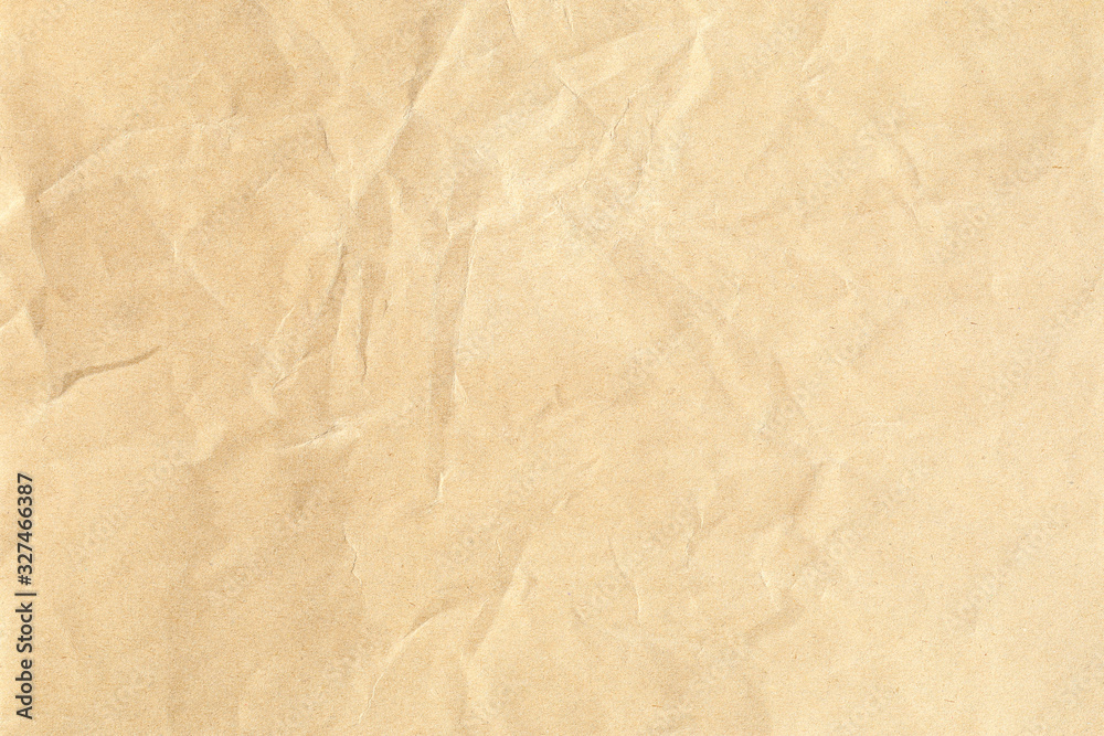 Obraz premium Crumpled brown paper background texture