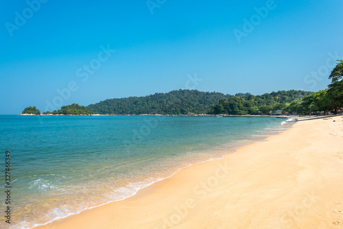 The island of Pangkor with the beach of the tourist village Teluk Nipah and the small isle of Giam in the Malaysian state of Perak at the west coast of the peninsular © ksl