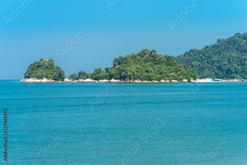 View to the island of Giam. A small rocky isle with a little beach close to the main island of Pangkor in Malaysia
