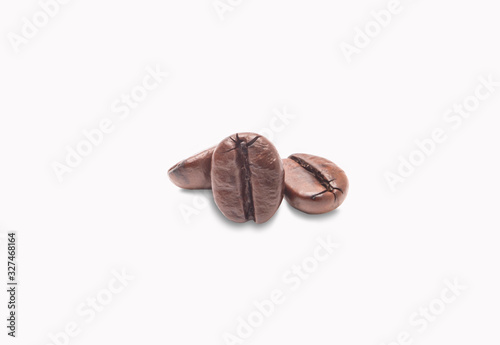 three coffee beans medium roast dark brown color solated on white background with clipping path