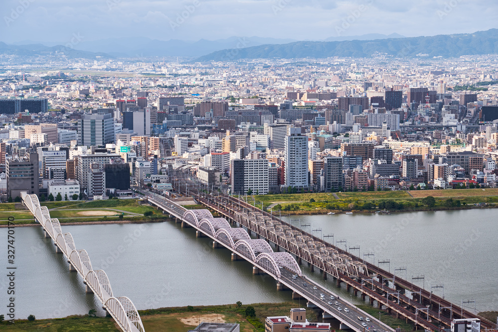 Fototapeta premium The birds eye view of Osaka city with Yodo River. Japan