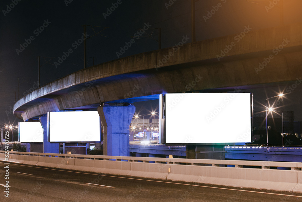 Obraz premium Billboard mockup outdoors, Outdoor advertising poster at night time with street light line for advertisement street city night.