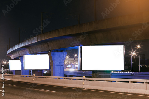 Billboard mockup outdoors, Outdoor advertising poster at night time with street light line for advertisement street city night.