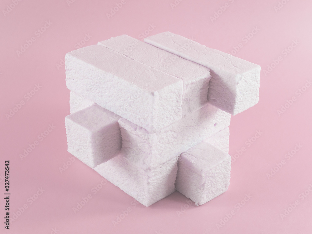 Sweet pink marshmallow rectangular shape in the form of a geometric shape. Marshmallows with the taste of cranberries, strawberries or other berries. Pop art design, creative concept Sweet pink marshmallow rectangular shape in the form of a geometric shape. Marshmallows with the taste of cranberries, strawberries or other berries. Pop art design, creative concept