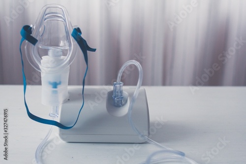 Medical equipment for inhalation with respiratory mask, nebulizer.  Asthma breathing treatment. Bronchitis, asthmatic health equipment.