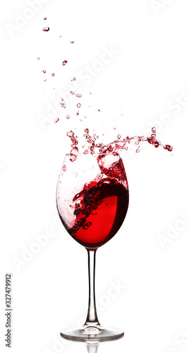 Red wine splash over white background, isolated
