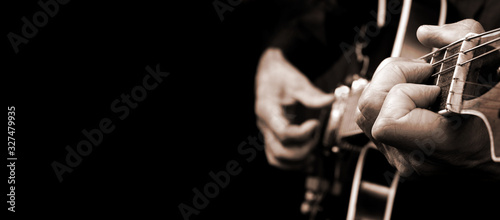 Guitarist hands and guitar close up. playing electric guitar black and white. copy space