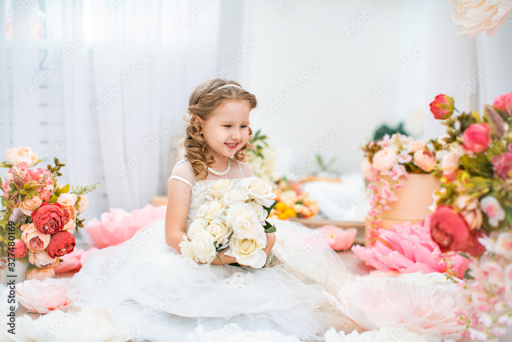Portrait cute little girl in beautiful dress with wavy, with bouquet of roses. Portrait cute little girl in beautiful dress with wavy, with bouquet of roses.
