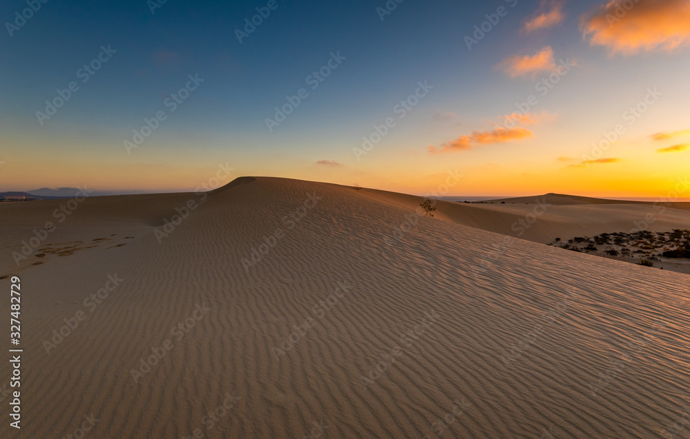 Sand dunes in the National Park of Dunas de Corralejo during a beautiful sunrise- Canary Islands - Fuerteventura.