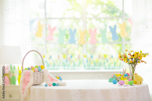 Photography Easter home decoration. Eggs basket and bunny.