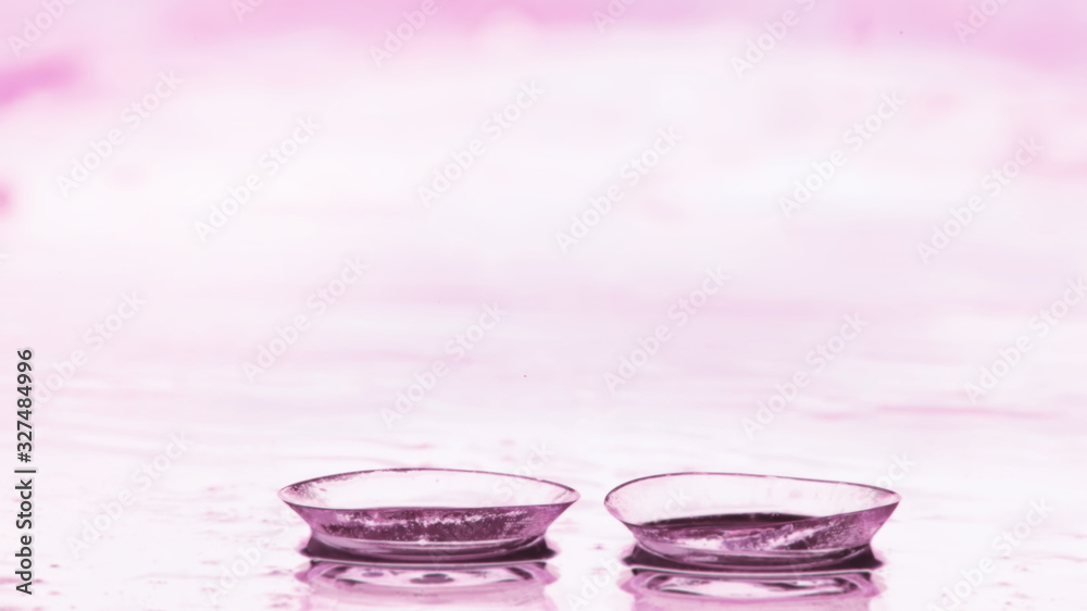 Tools for vision correction. Glasses and lenses with diopters on the background of splashes and blurry. Tools for vision correction. Glasses and lenses with diopters on the background of splashes and blurry.