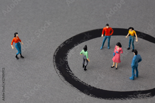 miniature woman outside and people in circles