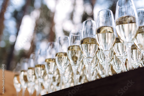 champagne glasses on a party table. Wedding stand-up meal