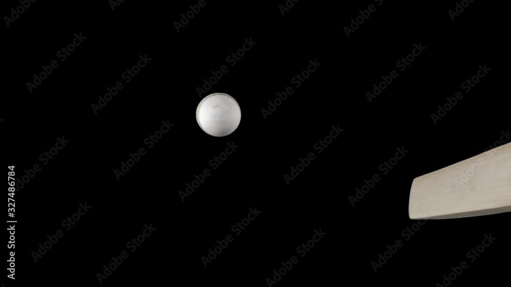 White cricket ball hitting bat and flying off in ultra slow motion