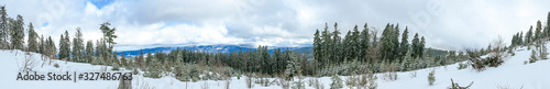 panorama photo of the Bavarian Forest with snow from the top of the mountain Arber