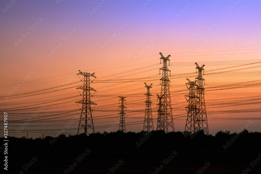 High voltage power tower and beautiful nature landscape at sunset