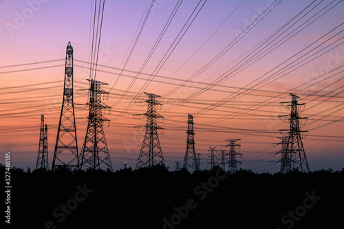 High voltage power tower and beautiful nature landscape at sunset