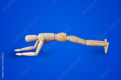 Sports wooden toy figure on blue
