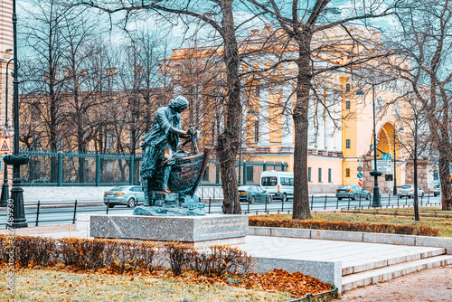 Admiralteyskaya Embankment and Carpenter King sculpture. Saint Petersburg. photo