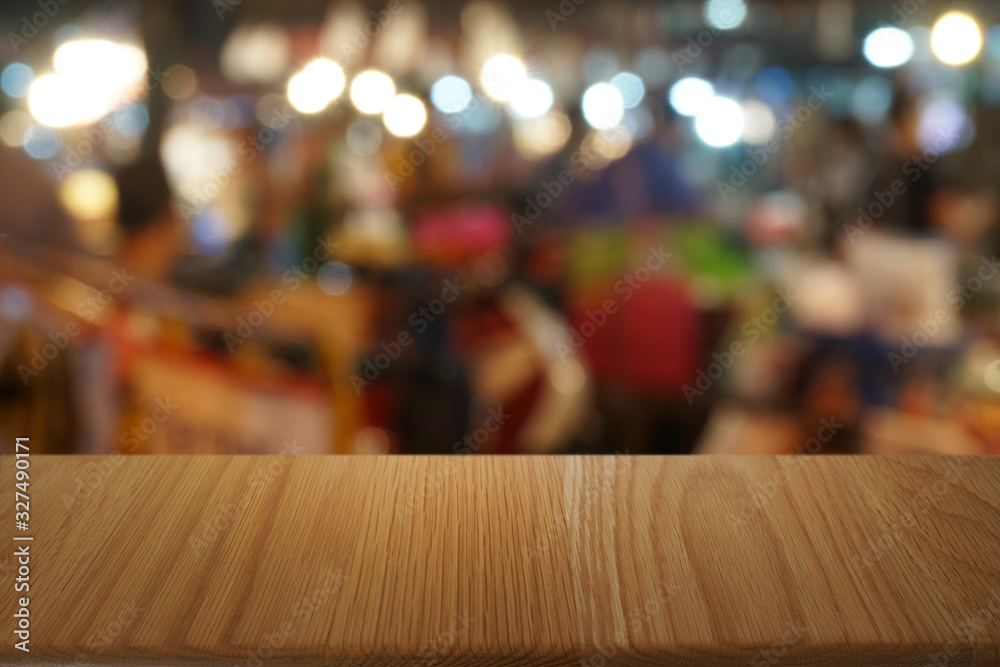 Empty dark wooden table in front of abstract blurred bokeh background of restaurant . can be used for display or montage your products.Mock up for space. Empty dark wooden table in front of abstract blurred bokeh background of restaurant . can be used for display or montage your products.Mock up for space.