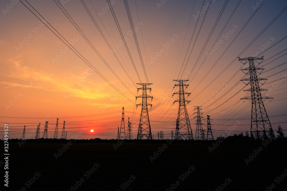 High voltage power tower and beautiful nature landscape at sunset