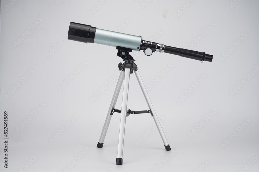 It's a small but portable blue telescope on a white background It's a small but portable blue telescope on a white background