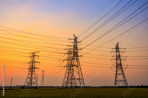 High voltage power tower and beautiful nature landscape at sunset