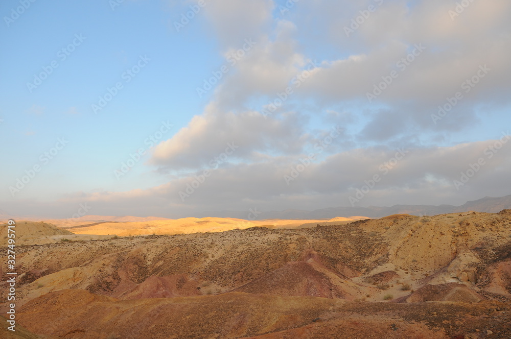 Desert landscape at sunrise. Hiking desert part of Israel National Trail. Negev desert . Valley. Colorful sands 