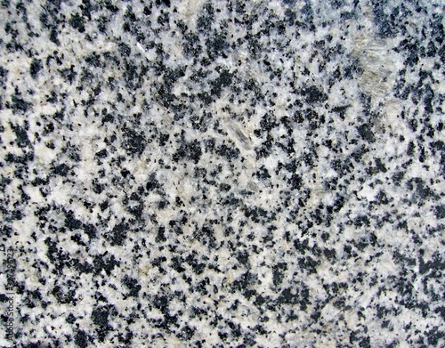 The texture of natural ornamental stone. Stone background. photo