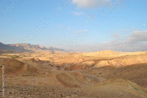 Desert landscape at sunrise. Hiking desert part of Israel National Trail. Negev desert . Valley. Colorful sands 