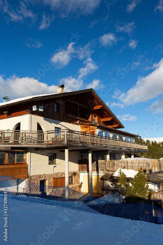 beautiful house in mountains on a sunny day © Diana Taliun