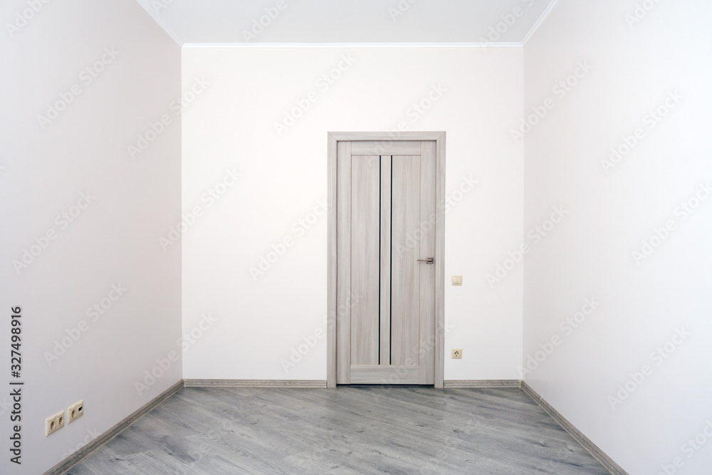 Empty room with the completed renovation, but without furniture Empty room with the completed renovation, but without furniture