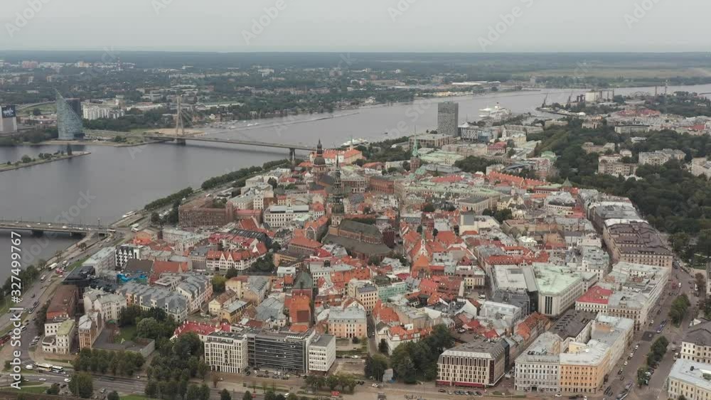 RIGA, LATVIA - MAY, 2019: Aerial drone view of the historical sights of Riga, cathedral spiers and bridge across river. RIGA, LATVIA - MAY, 2019: Aerial drone view of the historical sights of Riga, cathedral spiers and bridge across river.